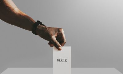 Man casting his vote to a ballot box mockup, quadratic funding can democratize community capital allocation