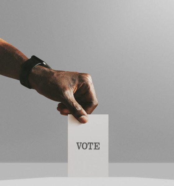 Man casting his vote to a ballot box mockup, quadratic funding can democratize community capital allocation