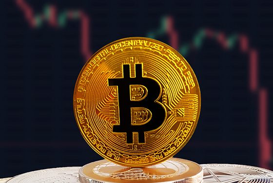 BTC on stack of cryptocurrencies with falling crashing graph in background