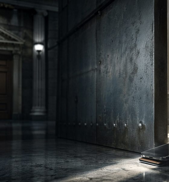 Smartphone propping open a heavy government-style door in a grand hall, symbolizing the SEC creating a narrow path for on-chain securities apps without waiting for Congress